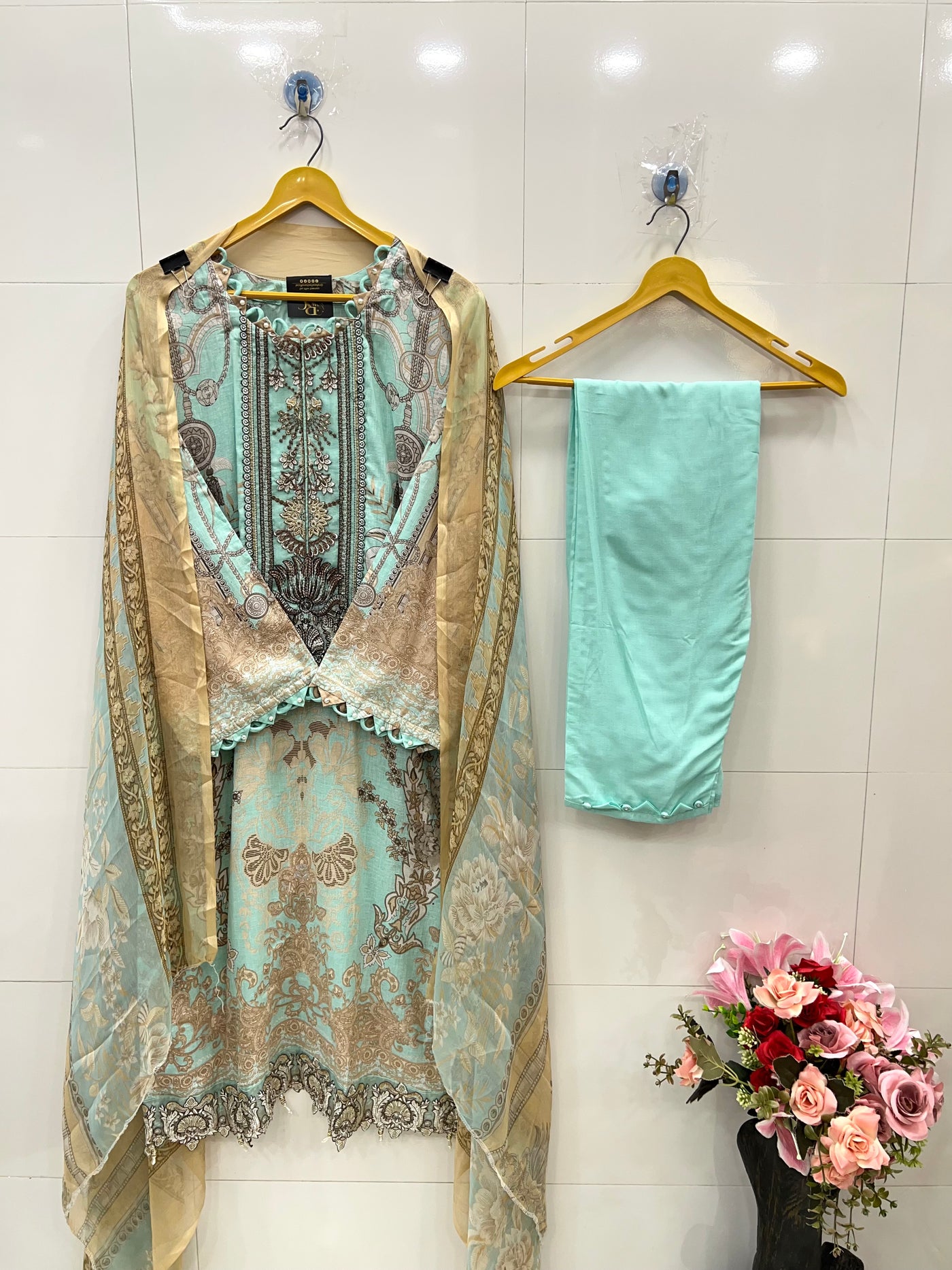 Pakistani pearl embellished suits 
2569