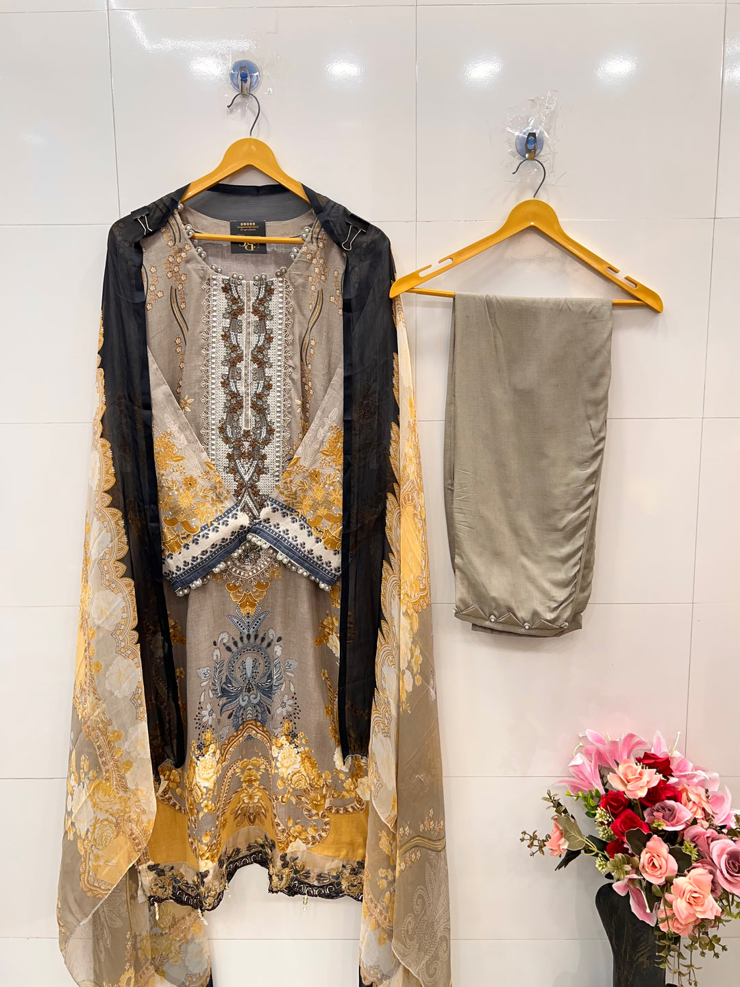 Pakistani pearl embellished suits 
2569