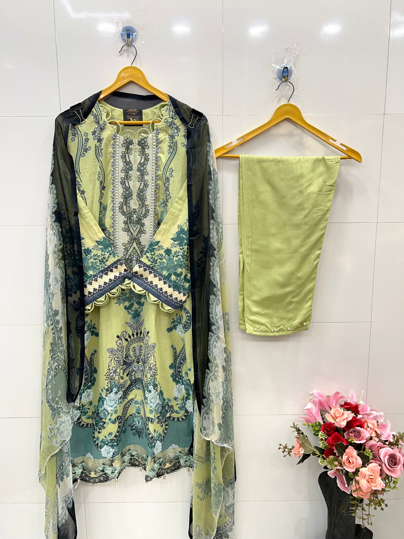 Pakistani pearl embellished suits 
2569