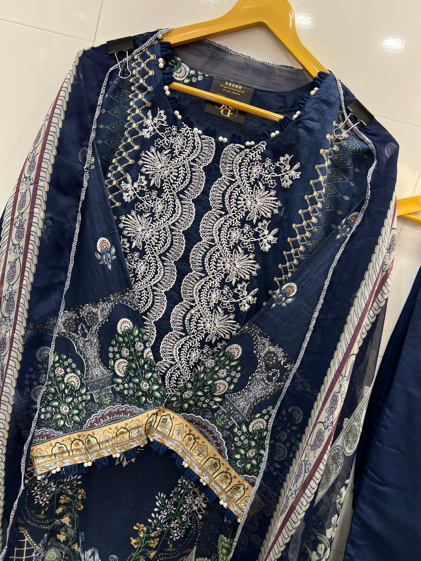 Pakistani pearl embellished suits 
2569