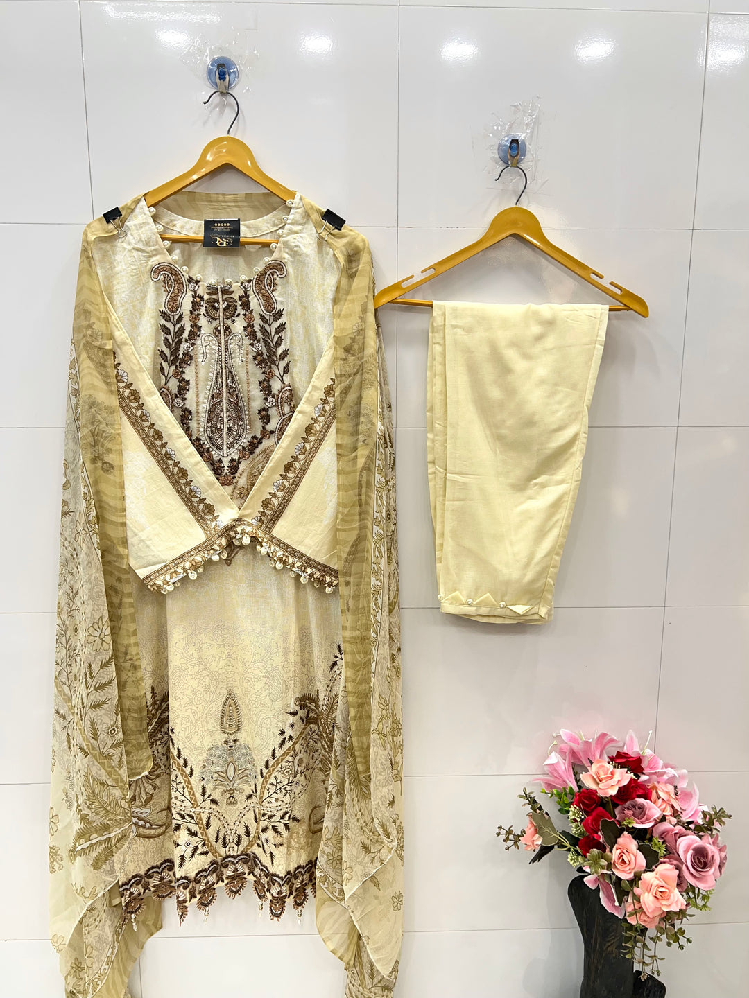 Pakistani pearl embellished suits 
2569