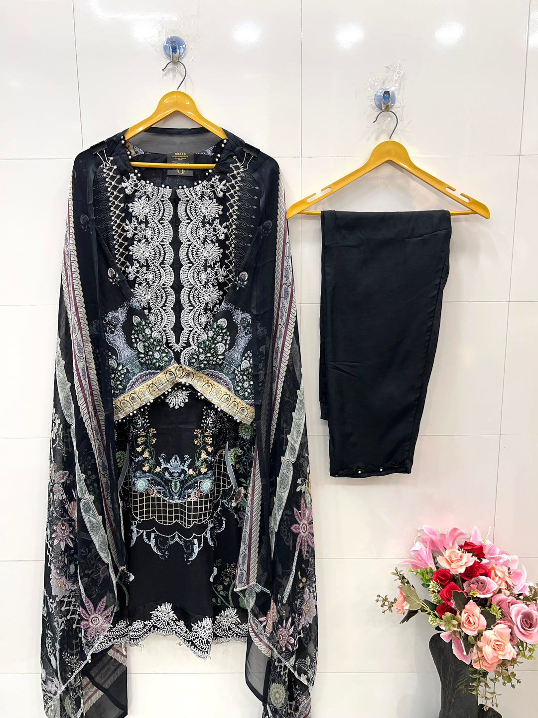 Pakistani pearl embellished suits 
2569