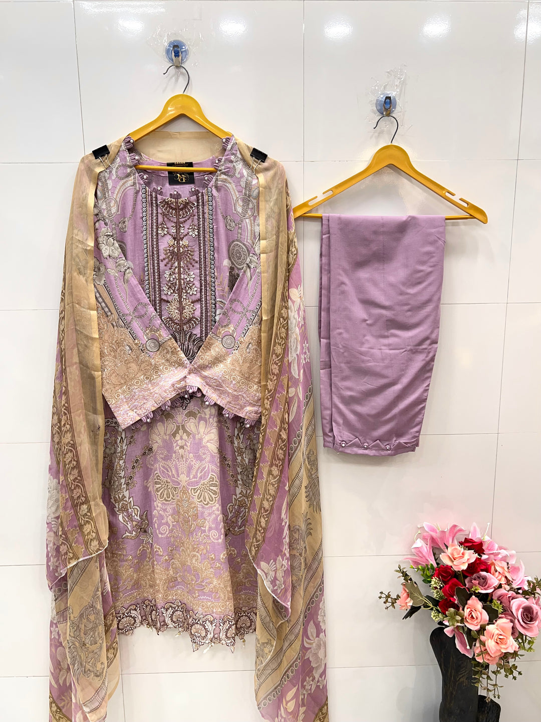 Pakistani pearl embellished suits 
2569