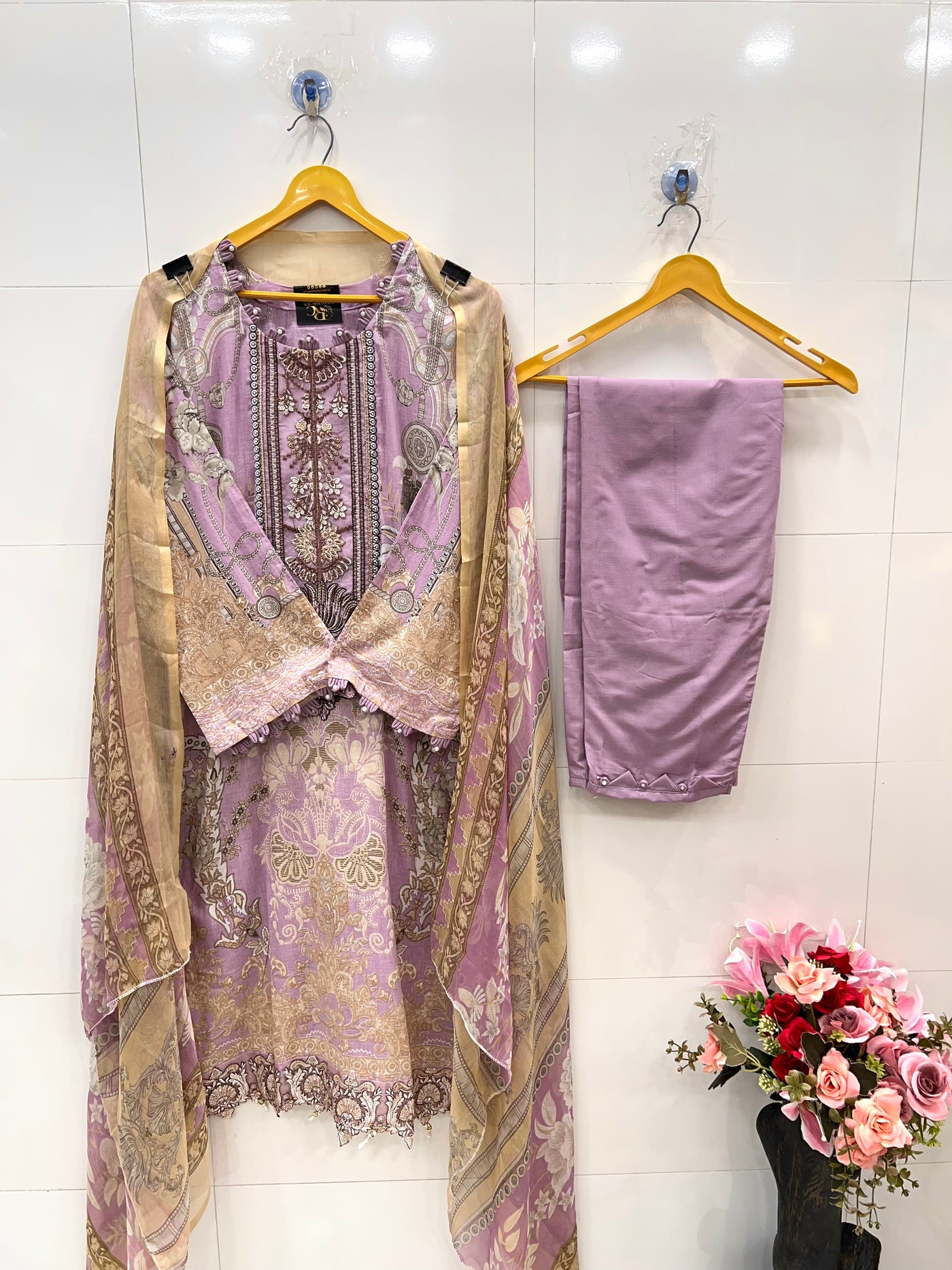 Pakistani pearl embellished suits 
2569