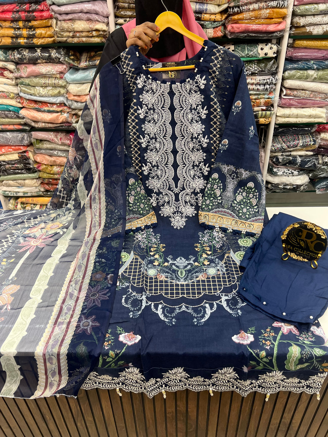 Pakistani pearl embellished suits 
2569