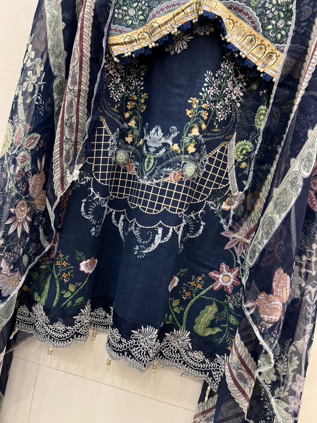 Pakistani pearl embellished suits 
2569