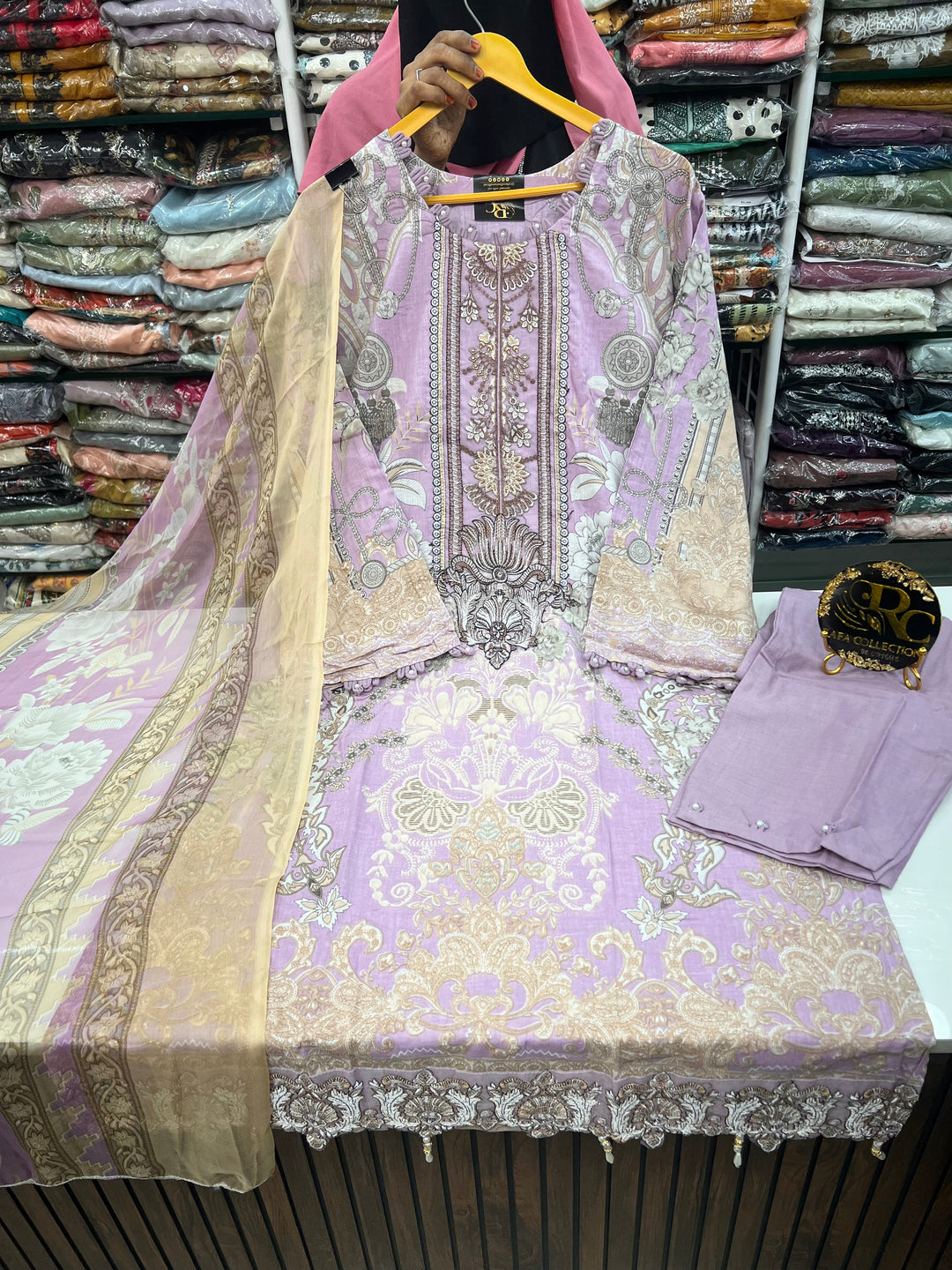 Pakistani pearl embellished suits 
2569