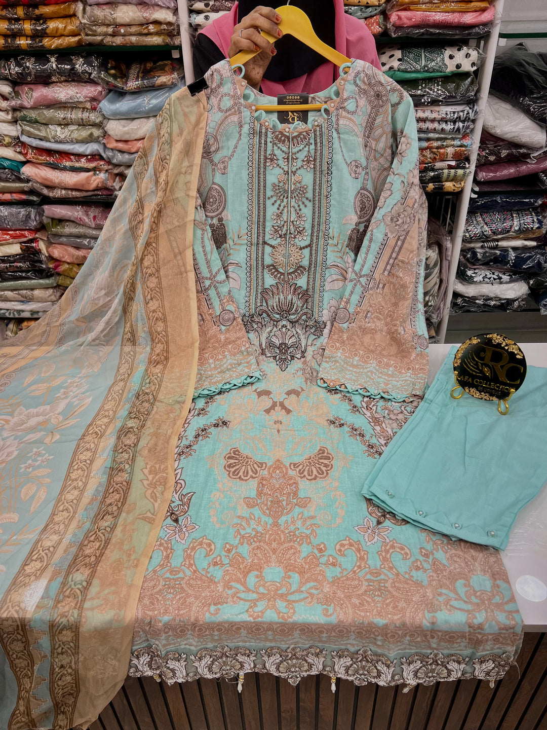 Pakistani pearl embellished suits 
2569